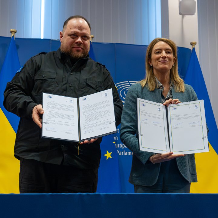 May be an image of 2 people and text