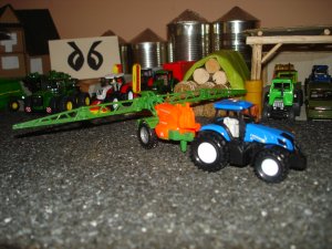 New Holland + opryskiwacz Amazone