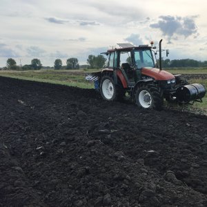 New Holland L 95 + Rabe Werk 